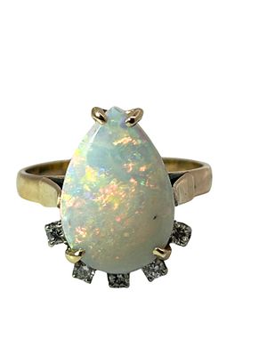 14K Opal & Diamond Ring. This exquisite vintage ring features a striking pear-shaped opal 
