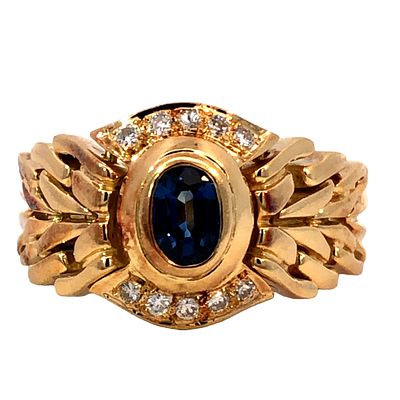 Flex Band Sapphire & Diamond Ring. S/10.4-MNSS 
This striking 18k yellow gold ring features a 