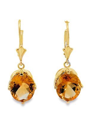 14K Citrine Earrings. Radiating a warm, golden glow, these 14k yellow gold earrings feature two 