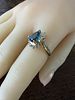 14K Topaz & Diamond Ring. Exhibiting a regal and fluid silhouette, this 14k yellow gold ring Image - 2