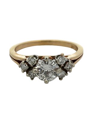 18K Diamond Ring. This exquisite 18K yellow gold ring is an elegant display of brilliant 