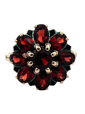 Ladies Garnet Ring. This bold 10K gold ring features a stunning floral cluster design showcasing 