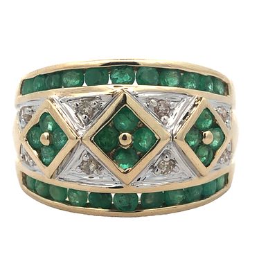 Emerald and Diamond Ring. Bold, intricate, and deeply colorful, this emerald and diamond band is 
