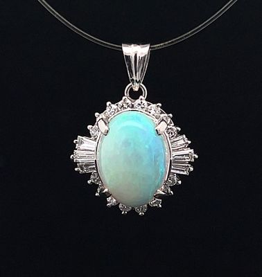 Opal & Diamond Pendant. ISL2418/8-LYS 
This mid-century style statement piece centers a luminous 