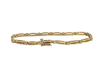 14K Diamond Bracelet. This elegant 14k yellow gold bracelet features a sophisticated series of 