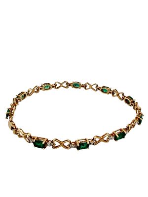 Two Tone Emerald Tennis Bracelet. Elevate your fine jewelry collection with this classic 