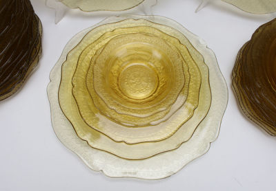 LOT OF AMBER DEPRESSION GLASS 
Including plates of varying sizes and small bowls. 