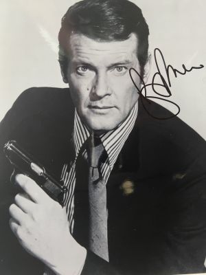 James Bond Roger Moore signed photo. GFA authenticated. 8x10 inches