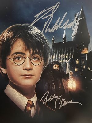 Harry Potter cast signed photo autographed by Daniel Radcliffe and Robbie Coltrane. 8x10 inches