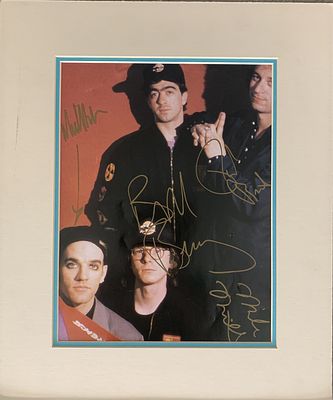 R.E.M. signed photo autographed by Michael Stipe, Mike Mills, Bill Berry and Peter Holsapple. 