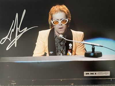 Elton John signed photo. 8x10 inches