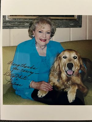 Betty White signed photo. Betty White photo autographed by Betty White and her dog Pontiac. 8x10