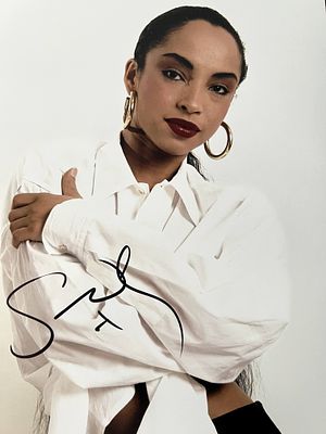 Singer Sade Adu signed photo. 8x10 inches