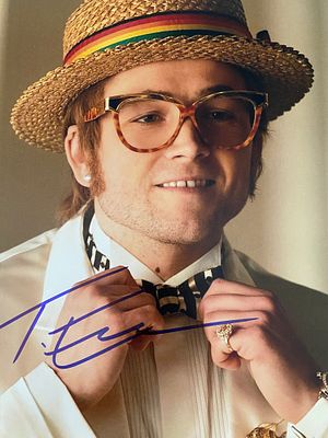 Rocketman Taron Egerton signed photo. 8x10 inches