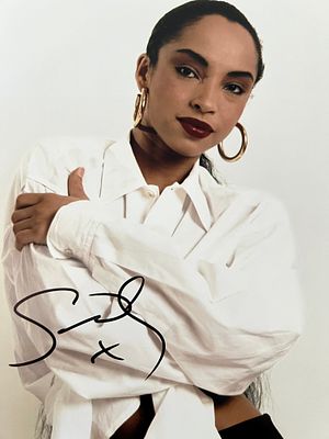 Singer Sade Adu signed photo. 8x10 inches