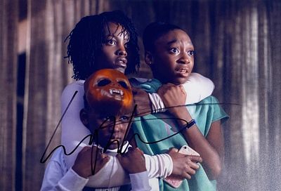 Us Lupita Nyong'o facsimile signed movie photo. Us facsimile signed movie photo autographed by 