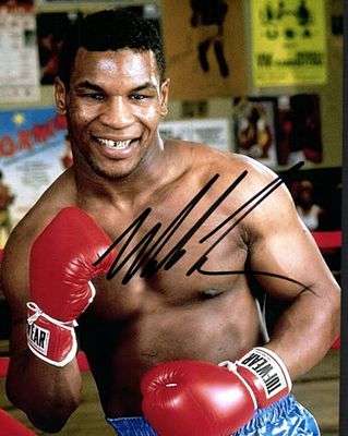 Mike Tyson facsimile signed photo. 8x10 inches. This item is a reprint of an original autograph