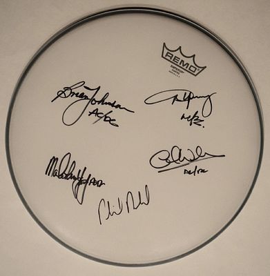 AC/DC signed drum head. AC/DC signed 14 Inch drum head. Signed: Brian Johnson AC/DC, Phil Rudd 
