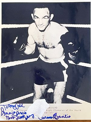 Welterweight Champion Boxer Carmen Basilio signed photo. Carmen Basilio signed photo. 8x10 inches