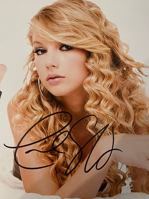 Taylor Swift signed photo. 8x10 inches