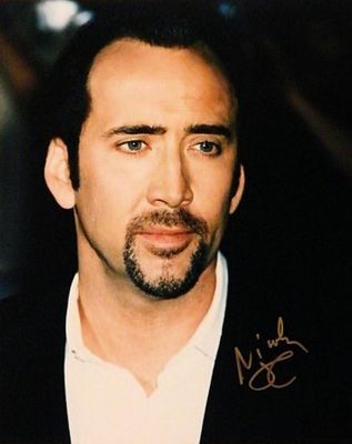 Face Off Nicholas Cage signed portrait photo. 8 in. by 10 in. Portrait photo autographed by 