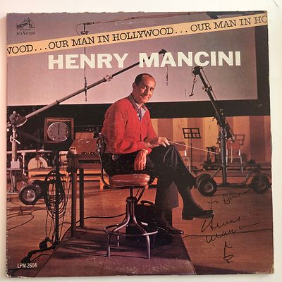 Henry Mancini Our Man In Hollywood signed album. 12x12 inches. Vinyl included.