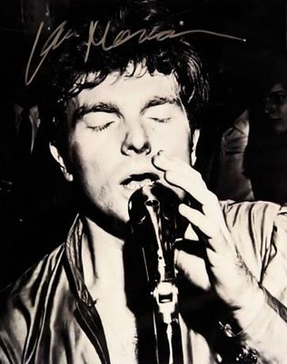 Van Morrison signed promo photo. 8 in. by 10 in. Black and white photo autographed by Van Morrison.