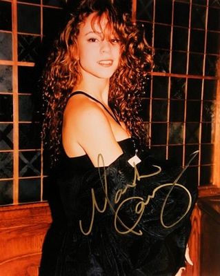Mariah Carey signed photo. 8 in. by 10 in. Promotional photo autographed by Mariah Carey.