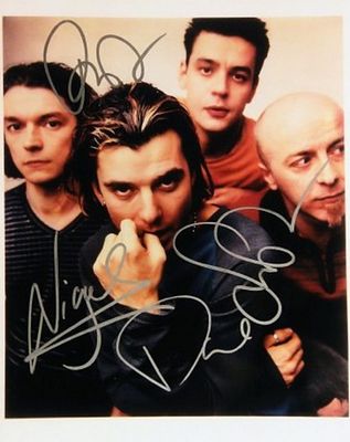 Bush signed photo. 8 in. by 10 in. Bush promotional photo autographed by Gavin Rossdale, Chris 