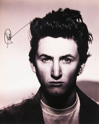 Sean Penn signed portrait photo. 11 in. by 13 in. Black and white portrait photo autographed by 