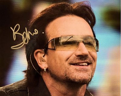 U2 facsimile signed photo. U2 promotional photo autographed by Bono. 8x10 inches. This item is a 