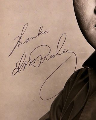 Elvis Presley facsimile signed promo photo. Elvis Presley portrait photo autographed as: Thanks 