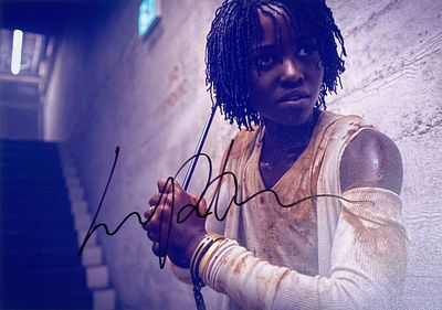Us Lupita Nyong'o facsimile signed movie photo. Us facsimile signed movie photo autographed by 