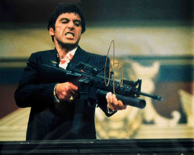 Scarface signed movie photo. 8 in. by 10 in. Movie photo from Scarface signed Al Pacino.