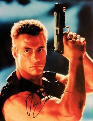Jean-Claude Van Damme signed movie photo. 8 in. by 10 in. Movie photo autographed by Jean-Claude 