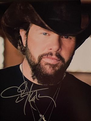 Toby Keith signed photo. 8x10 inches