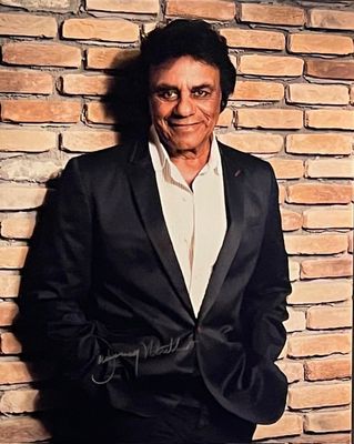 Singer Johnny Mathis signed photo. 8x10 inches