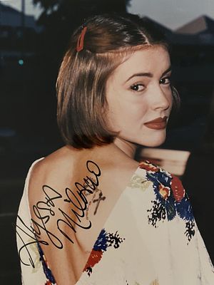 Commando Alyssa Milano signed photo. Alyssa Milano autographed photo. 8x10 inches