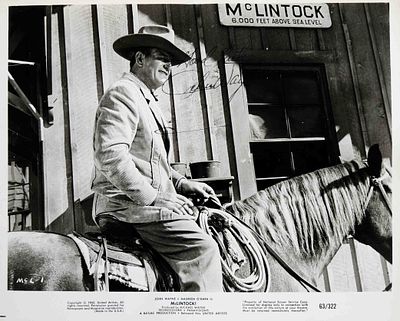 John Wayne signed portrait photo. 8 in. by 10 in. Black and white portrait photo. Signed: Good 