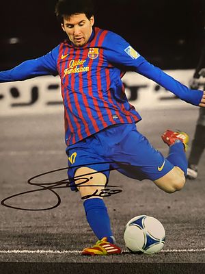 Lionel Messi signed photo. 8x10 inches