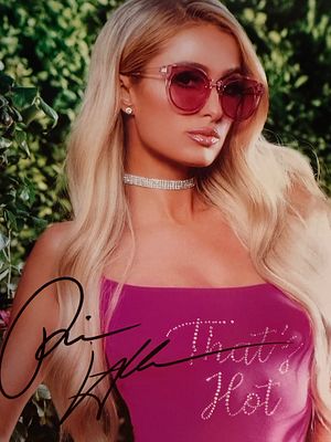 Paris Hilton signed photo. 8x10 inches