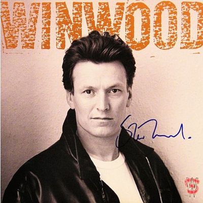 Steve Winwood signed "Roll With It" album. Steve Winwood 1988 "Roll With It" album autographed 