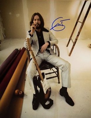 Eric Clapton signed promo photo. 11 in. by 14 in. Promotional photo autographed by Eric Clapton.