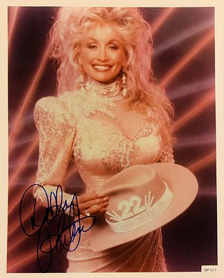 Dolly Parton signed promo photo. 8 in. by 10 in. Promotional photo autographed by Dolly Parton.
