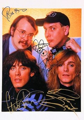 Cheap Trick signed promo photo. 11 in. by 14 in. Cheap Trick promotional photo autographed by 