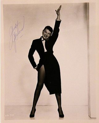 Judy Garland signed portrait photo. 8 in. by 10 in. Black and white portrait photo autographed 