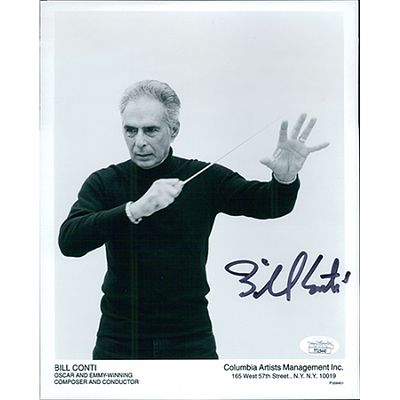 Composer Bill Conti signed photo. JSA Authenticated. Composer Bill Conti 8x10 matte finish promo 