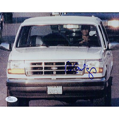 Al Cowlings signed photo. JSA Authenticated. Al Cowlings signed photo of OJ Simpson driving his 