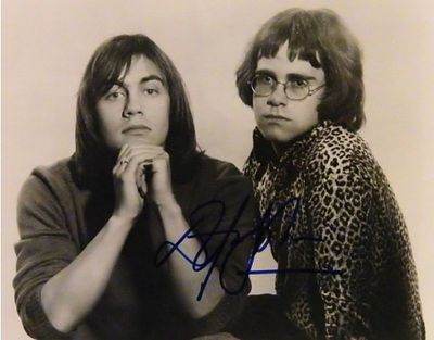 Elton John signed promo photo. 8 in. by 10 in. Black and white Promotional photo of Elton & 