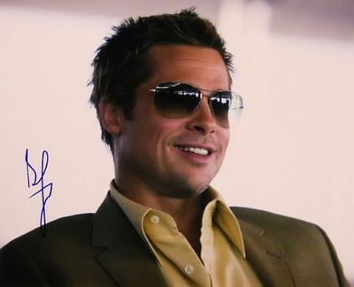 Brad Pitt signed Oceans Eleven photo. 8 in. by 10 in. Portrait photo autographed by Brad Pitt.